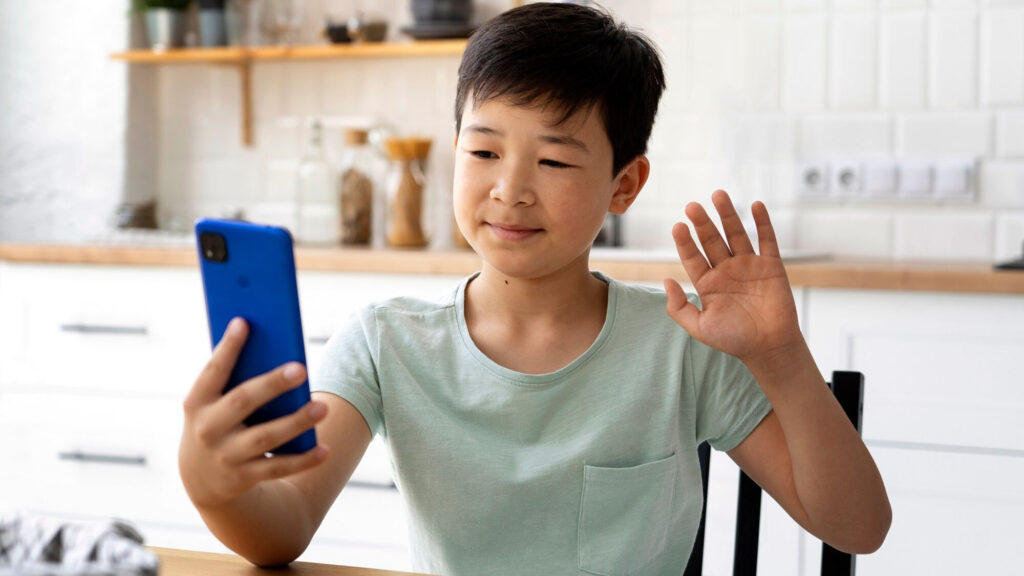 Kid recording himself while speaking, improving communication skills for interaction with other children